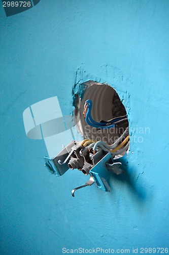 Image of open socket on the wall