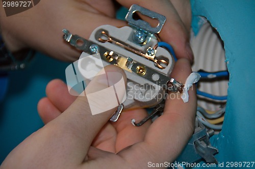 Image of a man's hand with the inside detail of a socket