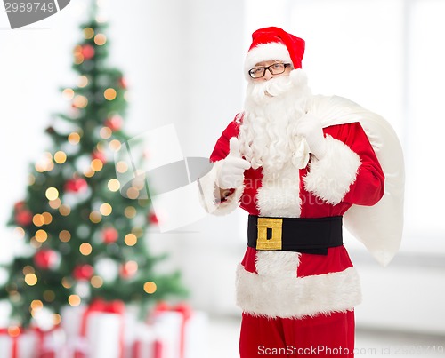Image of man in costume of santa claus with bag