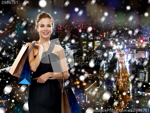 Image of smiling woman with shopping bags