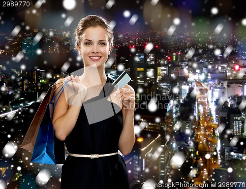 Image of smiling woman with shopping bags