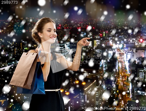 Image of smiling woman with shopping bags