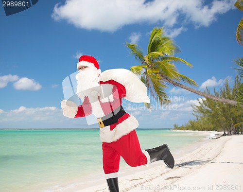 Image of man in costume of santa claus with bag