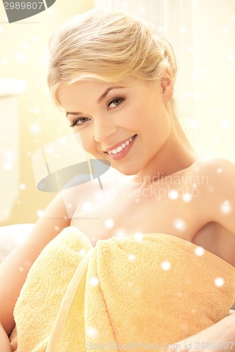 Image of beautiful young woman in towel indoors