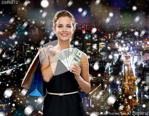 Image of smiling woman with shopping bags