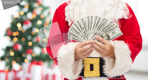 Image of close up of santa claus with dollar money