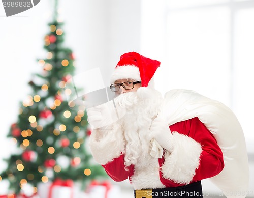 Image of man in costume of santa claus with bag