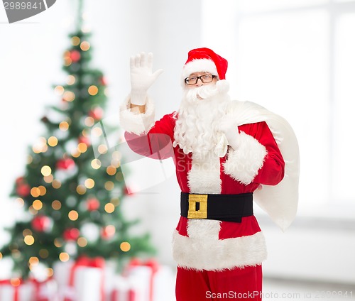 Image of man in costume of santa claus with bag