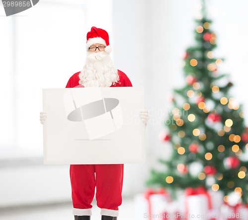 Image of man in costume of santa claus with billboard