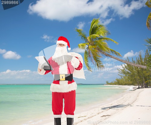 Image of man in costume of santa claus with notepad and bag