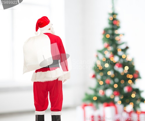 Image of man in costume of santa claus with bag