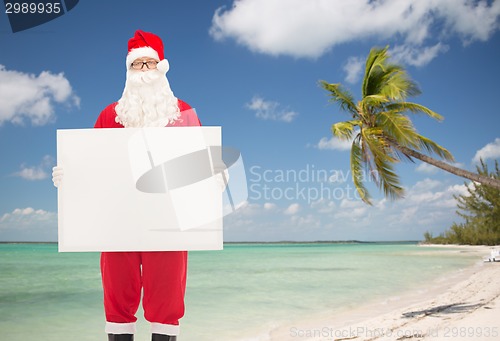 Image of man in costume of santa claus with billboard