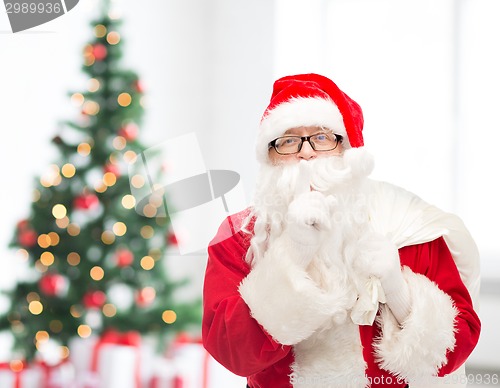 Image of man in costume of santa claus with bag