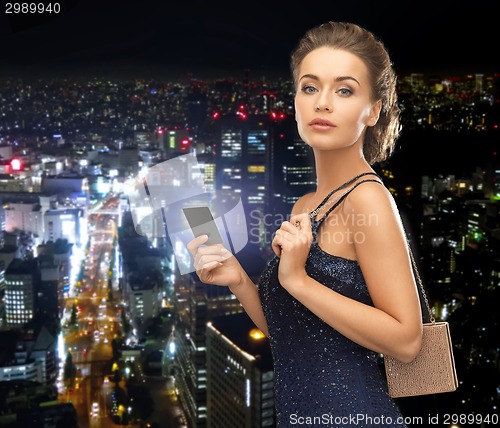 Image of woman in evening dress with vip card