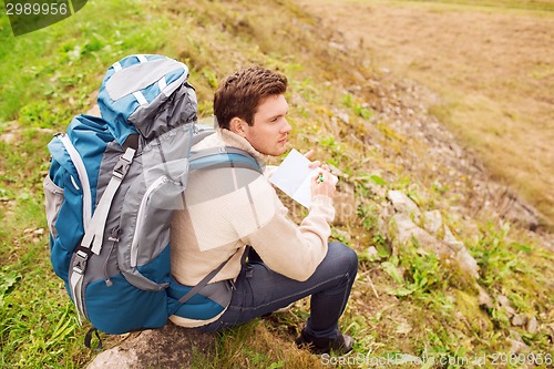 Image of man with backpack hiking