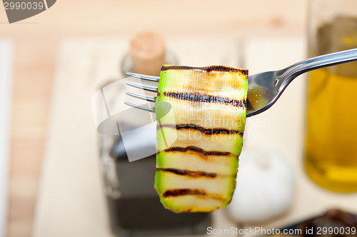 Image of grilled zucchini courgette on a fork