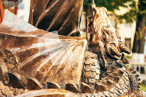 Image of Statue Of Archangel Michael With Outstretched Wings Before Red C