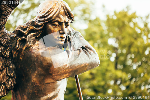 Image of Statue Of Archangel Michael With Outstretched Wings Before Red C