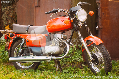 Image of Vintage Red Motorcycle Generic Motorbike In Countryside 