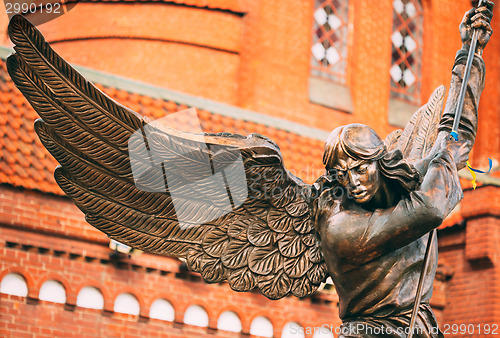 Image of Statue Of Archangel Michael With Outstretched Wings Before Catho