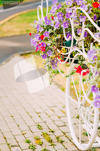 Image of White Decorative Bicycle Parking In Garden 