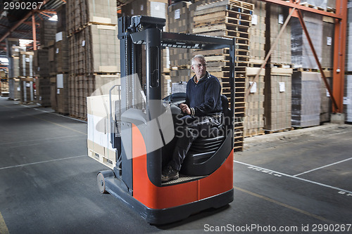 Image of Fork lift operator preparing products for shipment