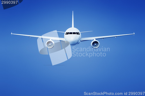 Image of airplane in the bright blue sky