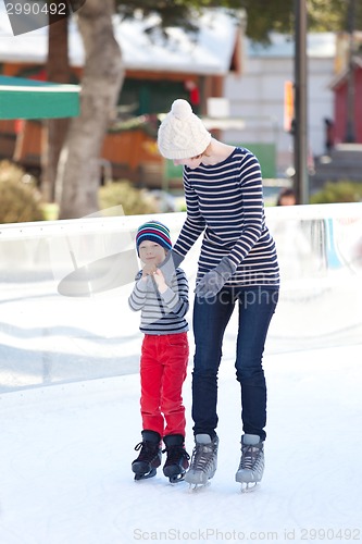 Image of family ice skating