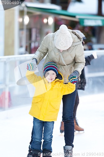 Image of family ice skating