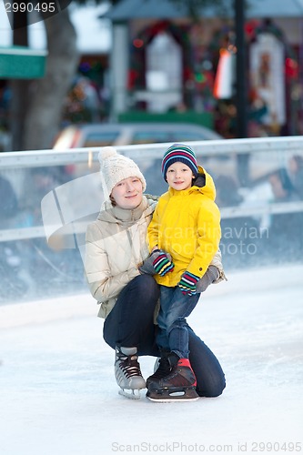 Image of family ice skating