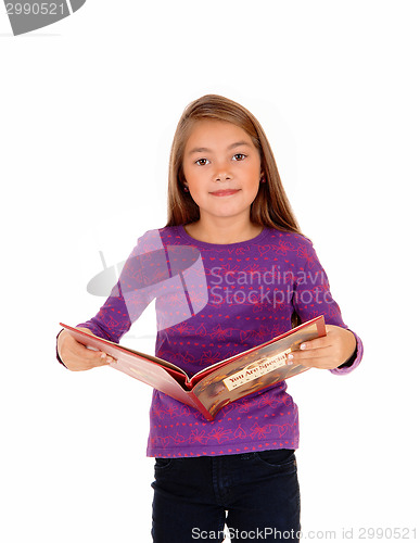 Image of Little girl with a book.