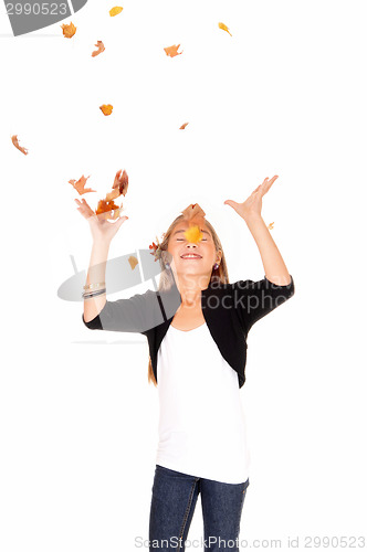 Image of Girl with falling leaves.