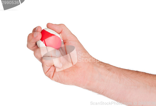 Image of Male hand with a red and white ball
