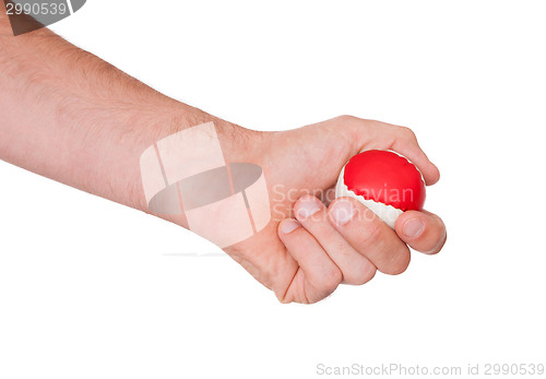 Image of Male hand with a red and white ball