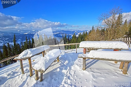 Image of Snow on table and seats