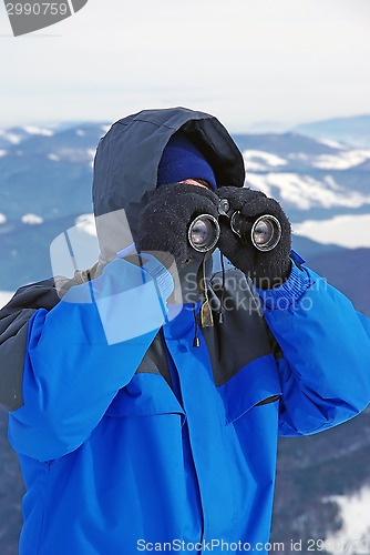 Image of Tourist looking through binocular
