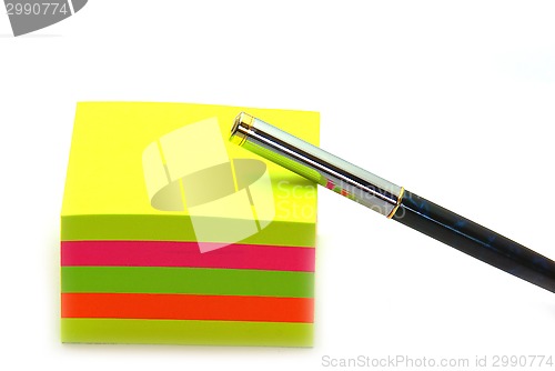 Image of Stack of post its and a pen