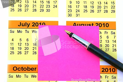 Image of Pink post it on calendar