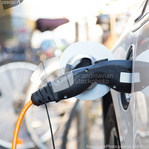Image of Electric Car in Charging Station.