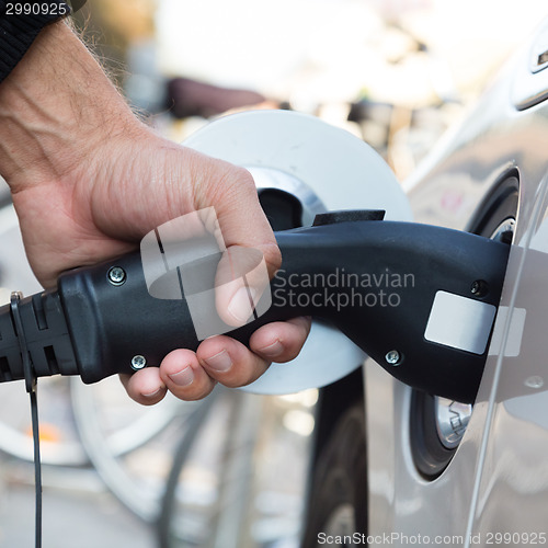 Image of Electric Car in Charging Station.