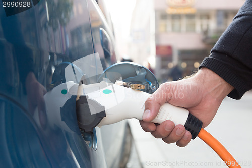 Image of Electric Car in Charging Station.