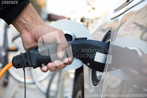 Image of Electric Car in Charging Station.