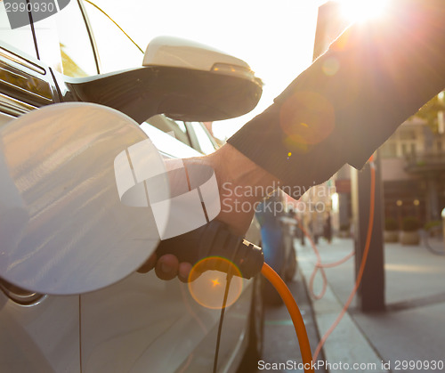 Image of Electric Car in Charging Station.