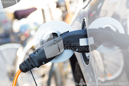 Image of Electric Car in Charging Station.