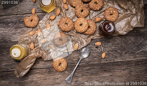 Image of Nuts and Cookies with sesame on wooden table