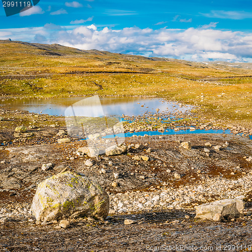 Image of Norway Nature Mountain Landscape With Stones And Lake. 