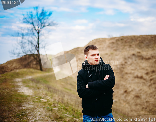 Image of Young Handsome Man Stayed In Field, Meadow In Autumn Day