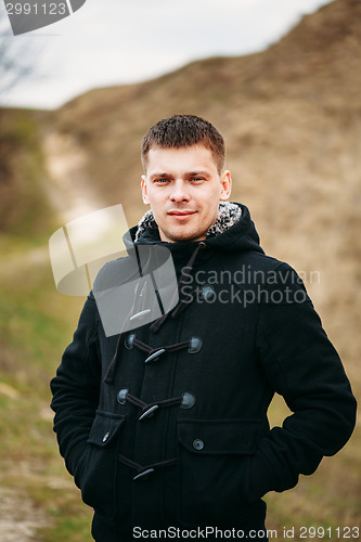 Image of Young Handsome Man Stayed In Field, Meadow In Autumn Day