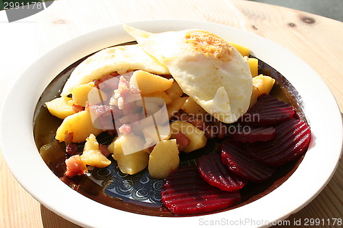 Image of Dish with bacon,egg,potato and beetroot