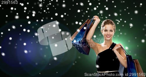 Image of smiling woman with shopping bags